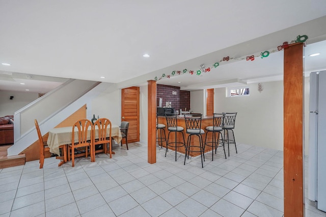 tiled dining space with bar