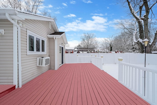 snow covered deck featuring a wall mounted AC