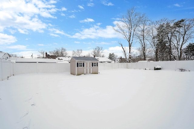 snowy yard with a storage unit