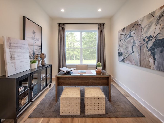 home office with recessed lighting, wood finished floors, and baseboards