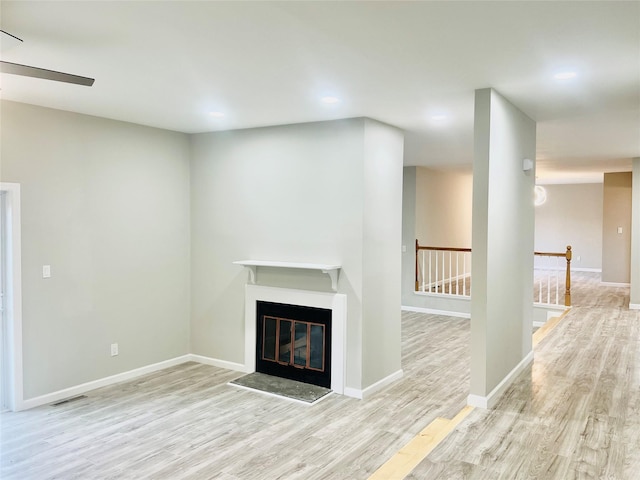 unfurnished living room with light wood-type flooring