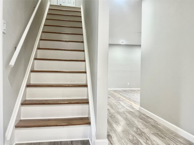 staircase featuring hardwood / wood-style flooring