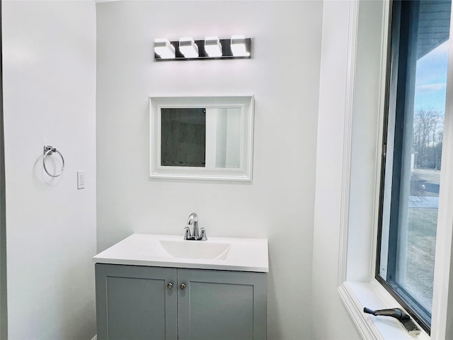 bathroom with vanity and a wealth of natural light