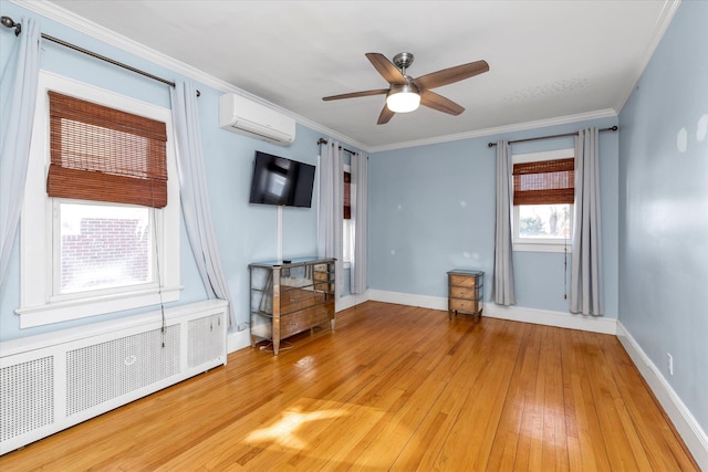 unfurnished living room with crown molding, a wall mounted AC, radiator, and light wood-type flooring