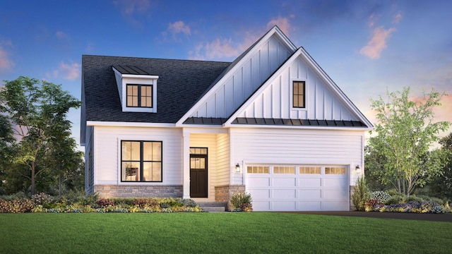 modern inspired farmhouse with a garage, stone siding, board and batten siding, a standing seam roof, and a front yard