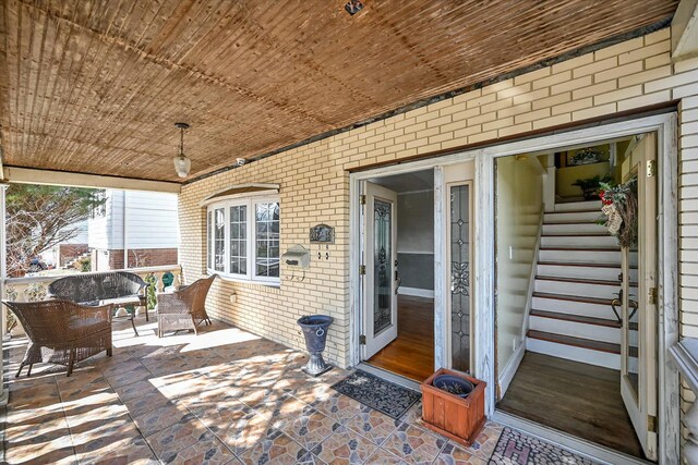 exterior space featuring brick siding