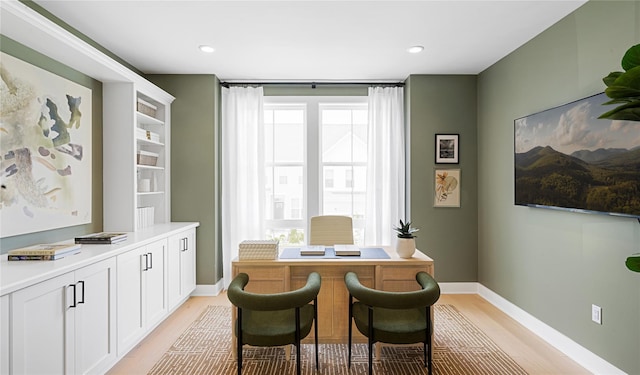 home office with light wood-style floors, recessed lighting, and baseboards