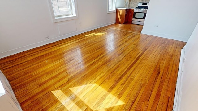 unfurnished living room with light wood-type flooring