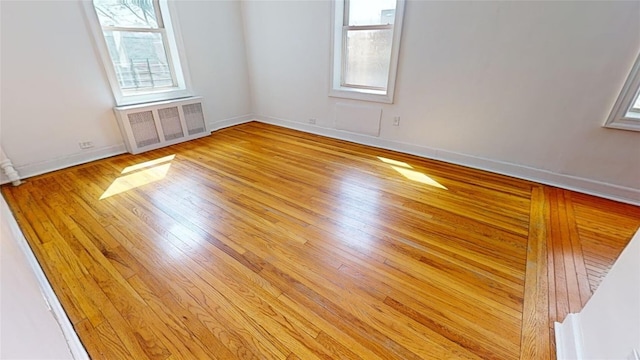 spare room with light wood-type flooring