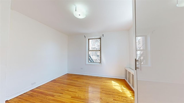 unfurnished room featuring light wood-type flooring