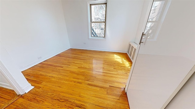 spare room with light hardwood / wood-style flooring