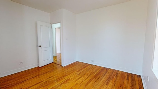 spare room featuring light wood-type flooring