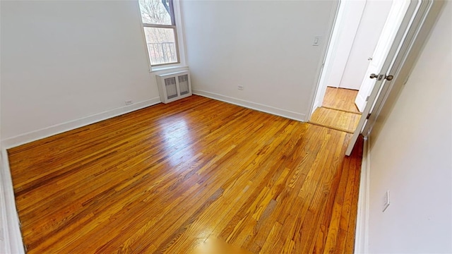 spare room featuring light hardwood / wood-style floors