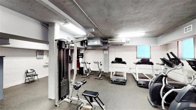 gym featuring a textured ceiling