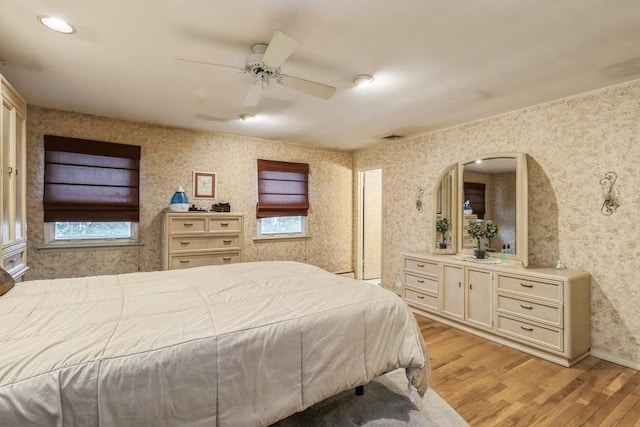 bedroom featuring ceiling fan and light hardwood / wood-style floors