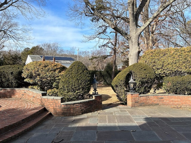 view of property's community featuring a patio area