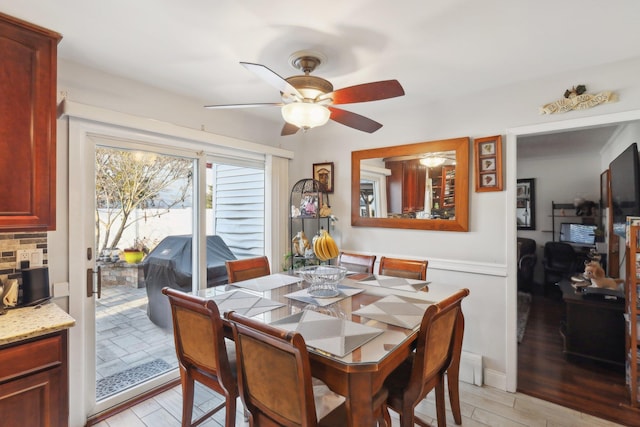 dining room featuring ceiling fan and light hardwood / wood-style floors