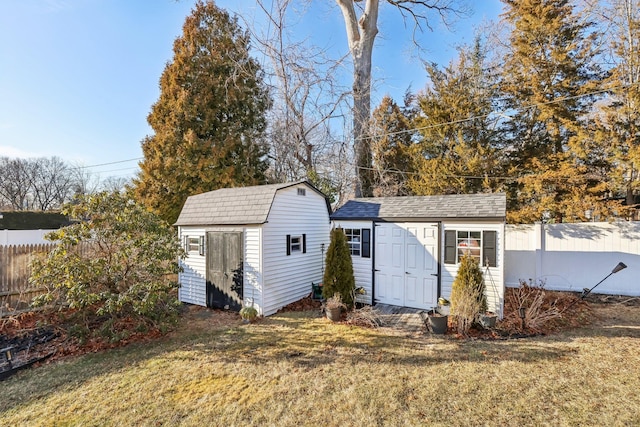 view of outbuilding featuring a yard