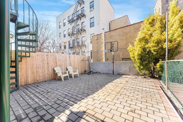 view of patio with basketball hoop