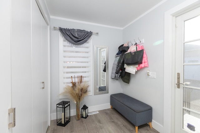 mudroom with crown molding and wood-type flooring