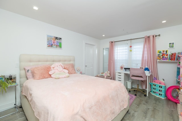 bedroom with wood-type flooring