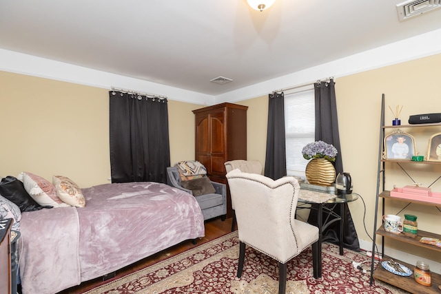 bedroom with wood-type flooring