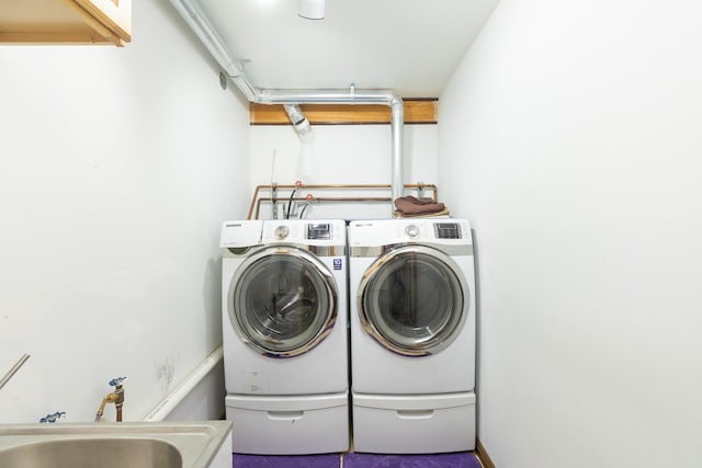 laundry room featuring sink and washing machine and clothes dryer