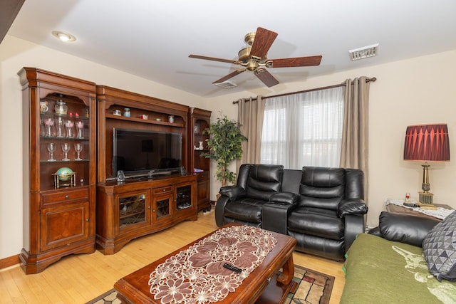 living room with ceiling fan and hardwood / wood-style floors