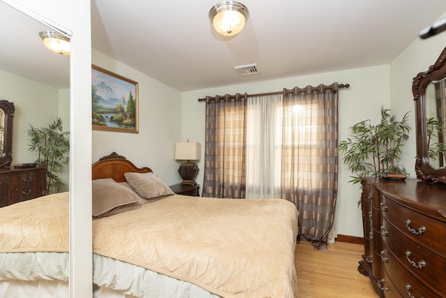 bedroom with light hardwood / wood-style floors