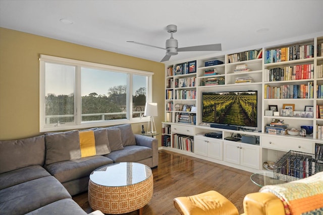 living room with hardwood / wood-style floors and ceiling fan