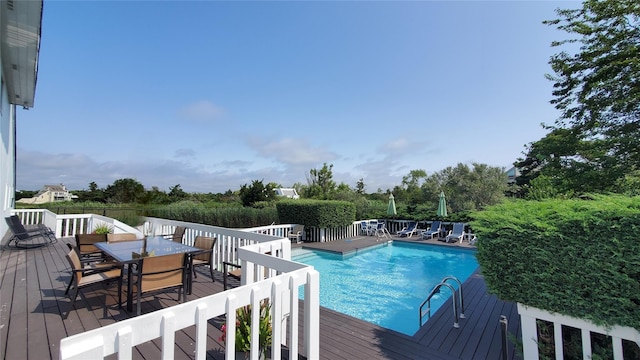 view of swimming pool featuring a deck