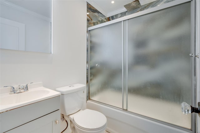 bathroom featuring toilet, shower / bath combination with glass door, ornamental molding, and vanity