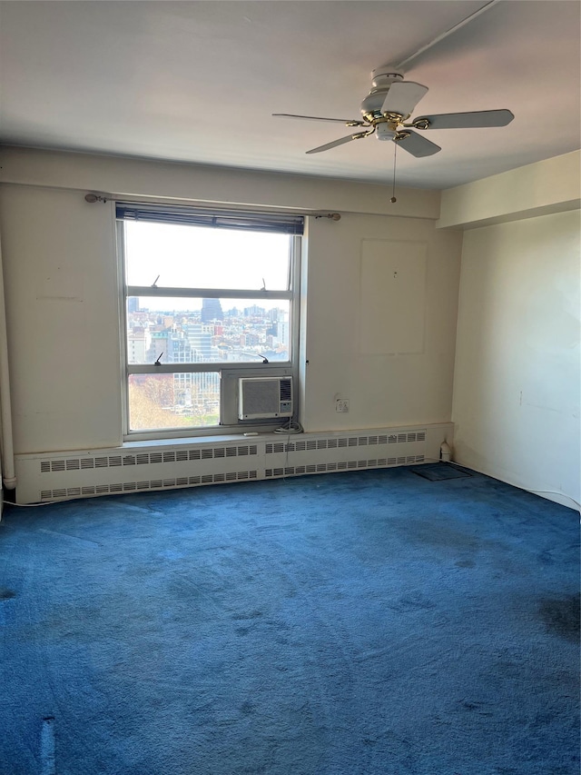 carpeted empty room featuring a baseboard heating unit and cooling unit