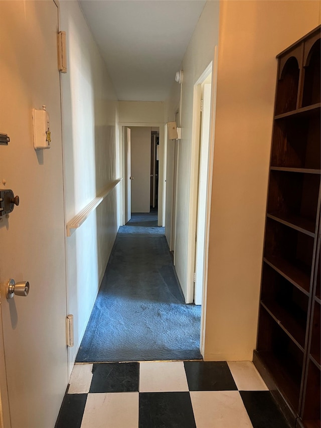 hallway with carpet floors