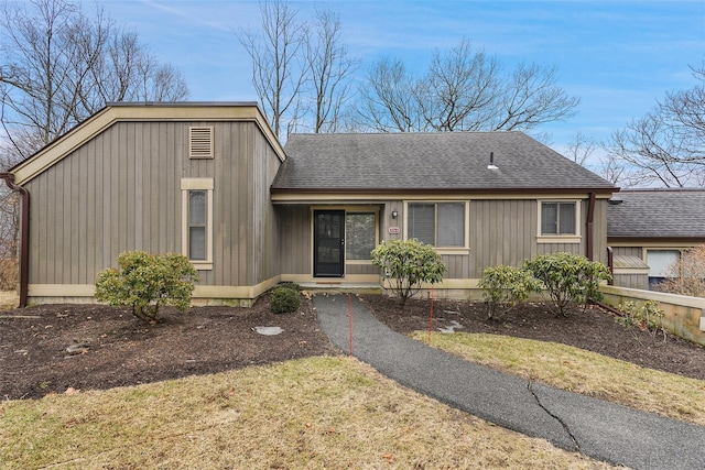 view of front of home with a shingled roof