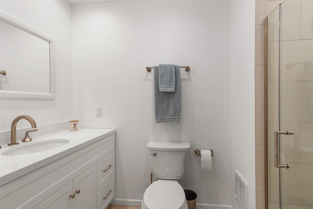 full bath featuring a stall shower, visible vents, vanity, and toilet