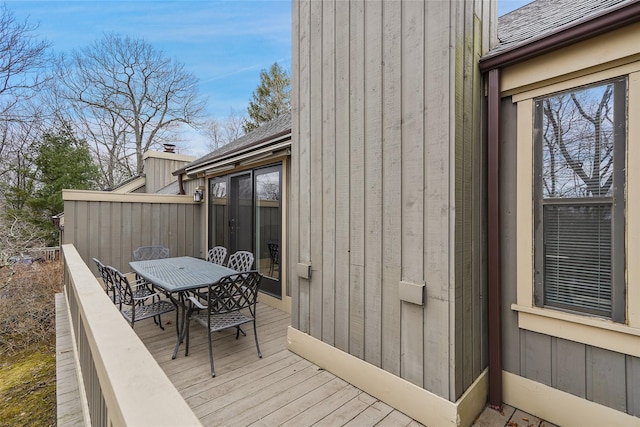 wooden deck with outdoor dining space