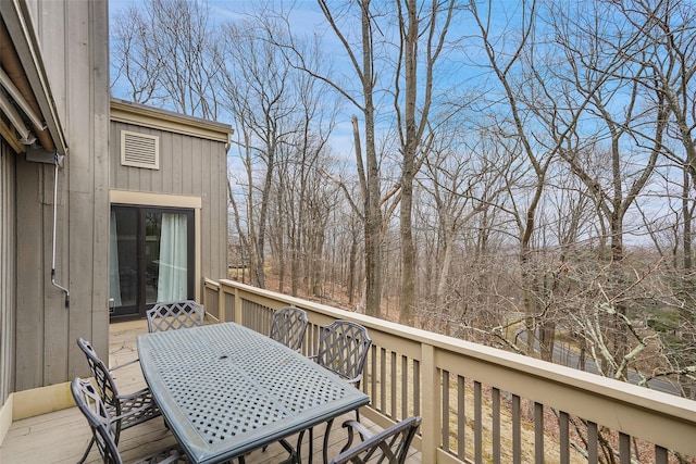 wooden deck with outdoor dining area