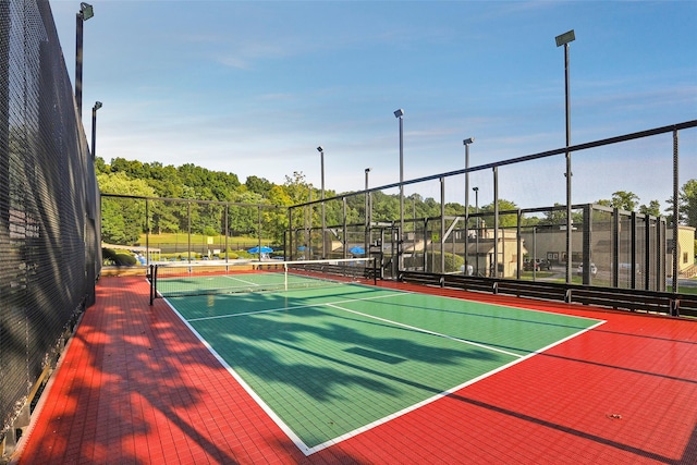 view of sport court featuring community basketball court and fence