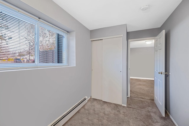 unfurnished bedroom featuring a closet and light carpet