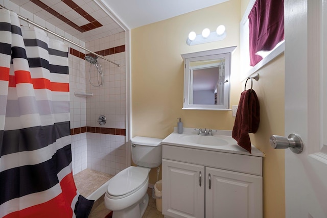 bathroom featuring a shower with curtain, vanity, and toilet