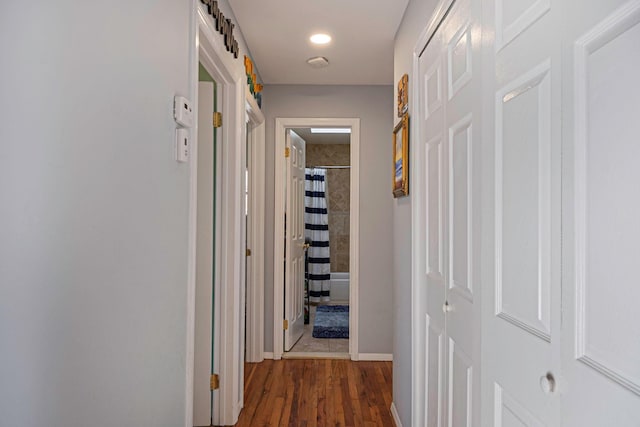 hall with dark wood-type flooring