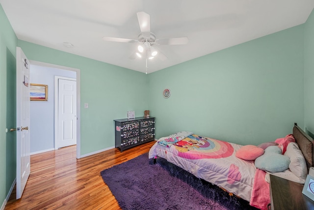 bedroom featuring ceiling fan and light hardwood / wood-style flooring