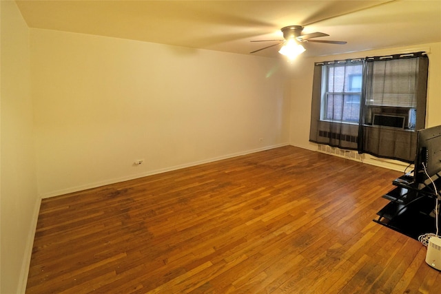 spare room featuring hardwood / wood-style flooring and ceiling fan