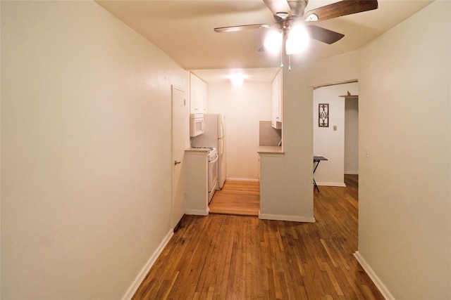 hall with dark hardwood / wood-style flooring