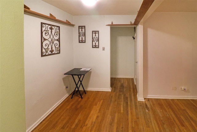 hall with hardwood / wood-style flooring