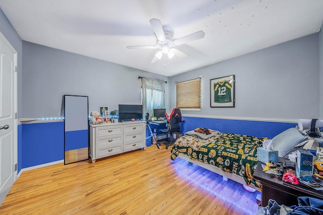 bedroom with ceiling fan and light wood-type flooring