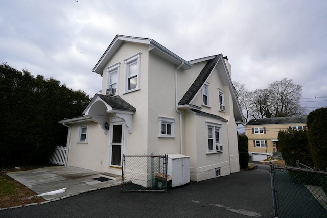 view of front of house with cooling unit