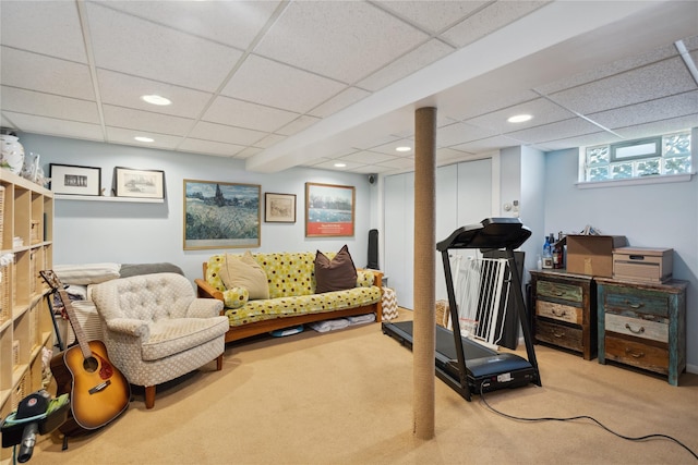 workout area featuring a paneled ceiling, carpet, and recessed lighting