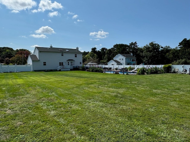 view of yard featuring a fenced backyard and a fenced in pool